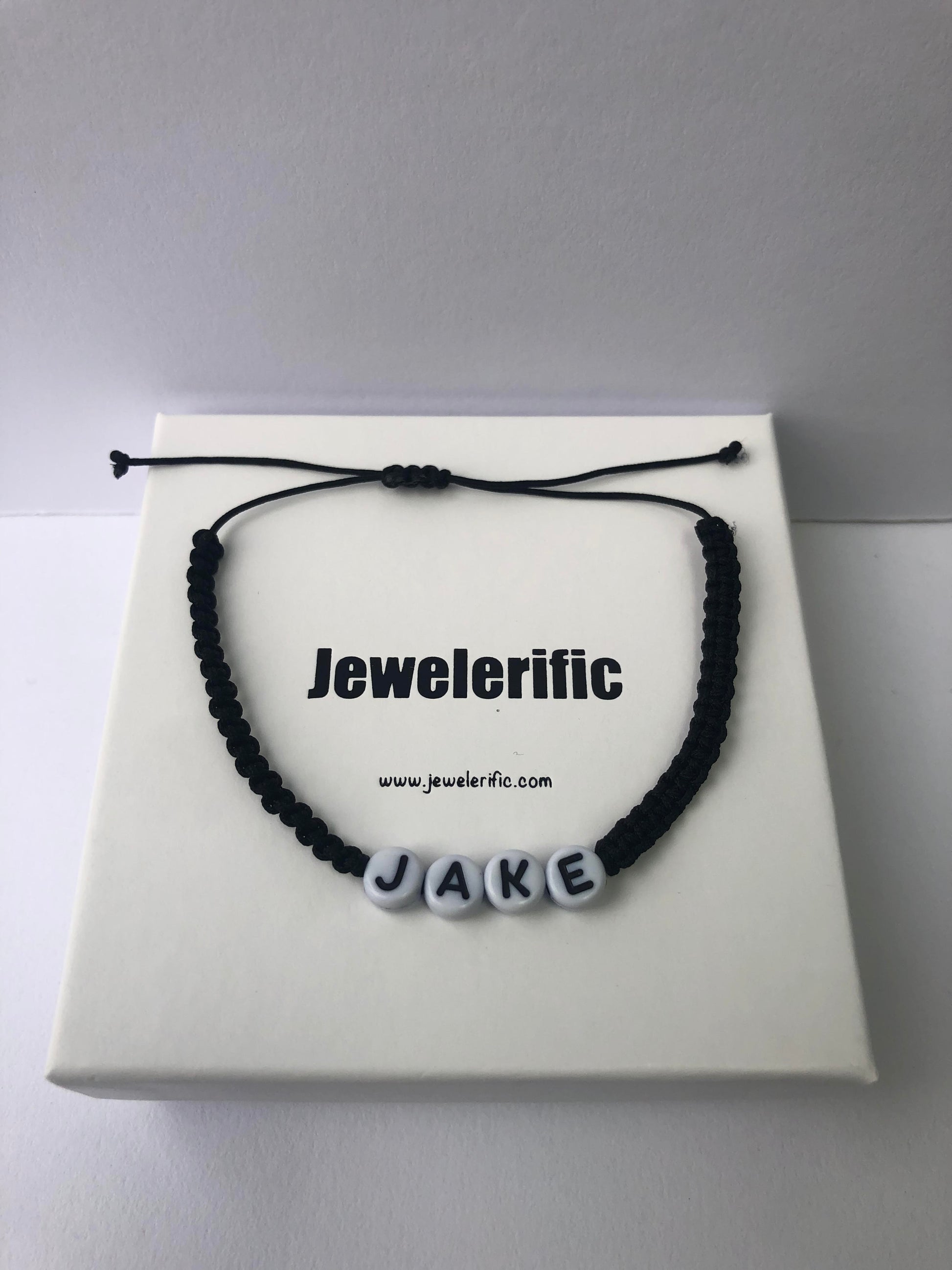 Black string bracelet name