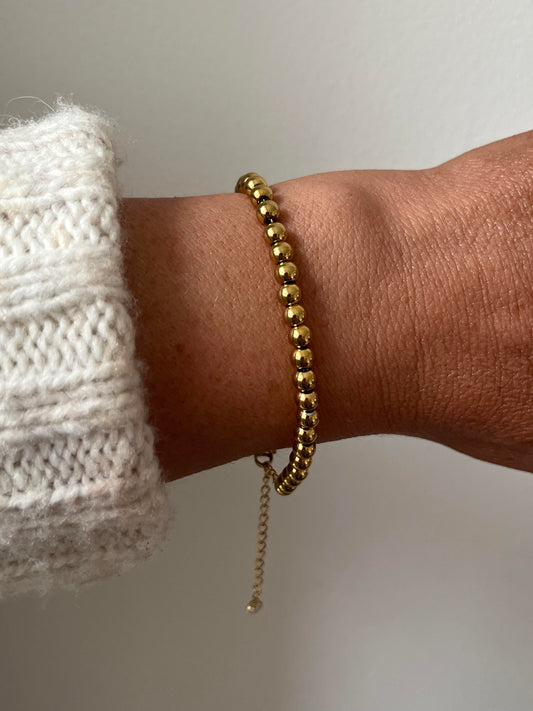 Gold beaded bracelet with extender chain