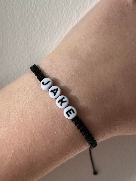Black string bracelet name